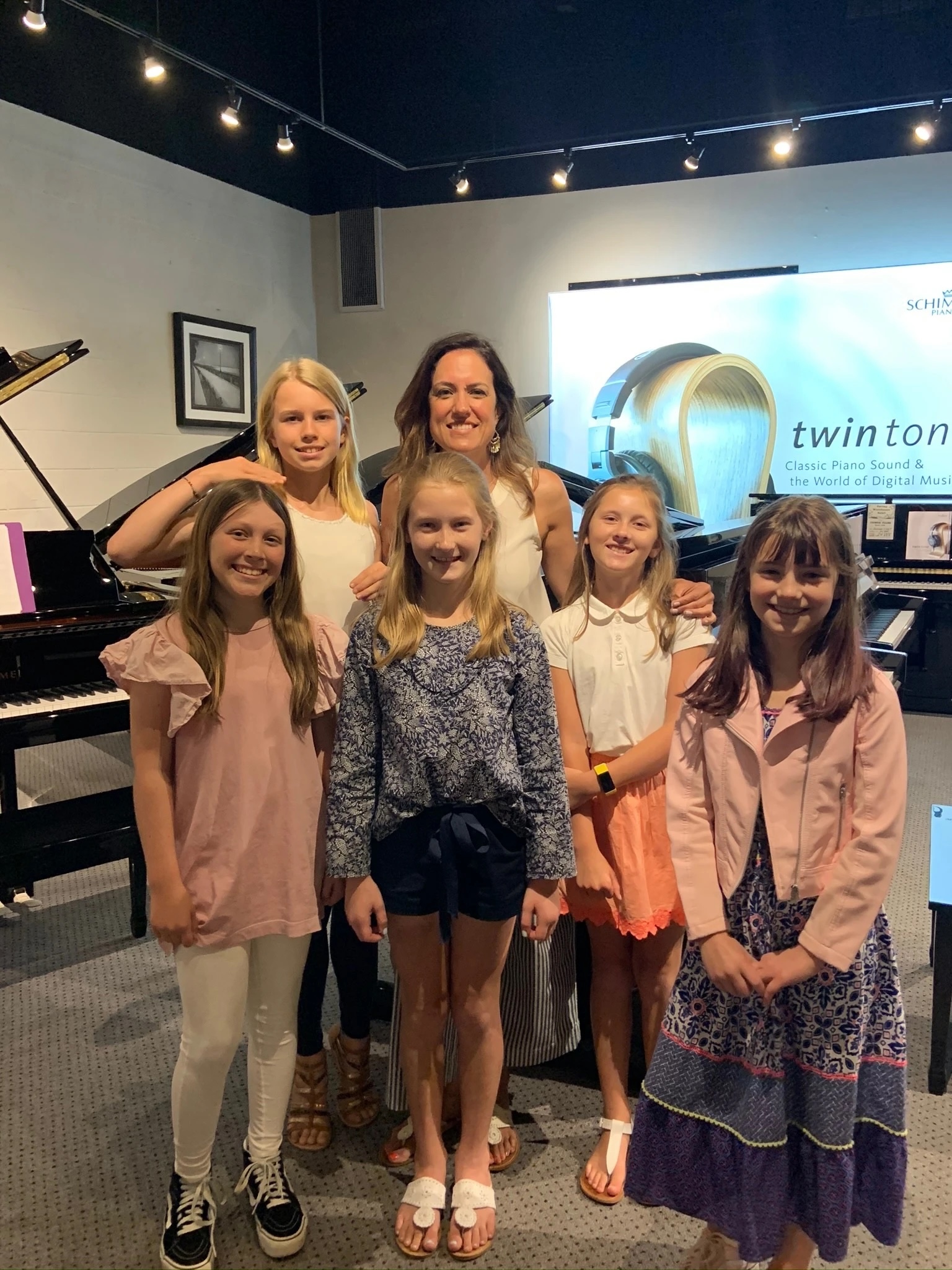 Piano students learning together